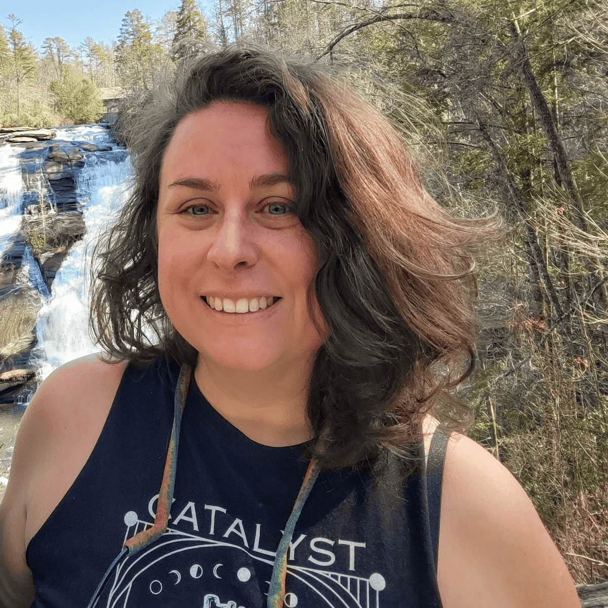 A Women in front of waterfalls